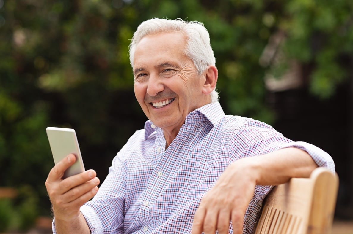 Happy Elderly Man Using Smartphone