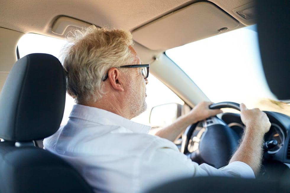 Happy Senior Man Driving Car